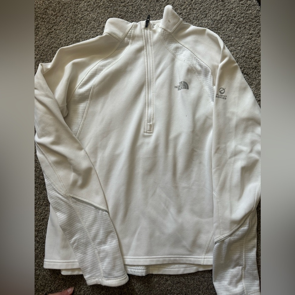 The north face white 1/4 zip up. Vapor wick material.
